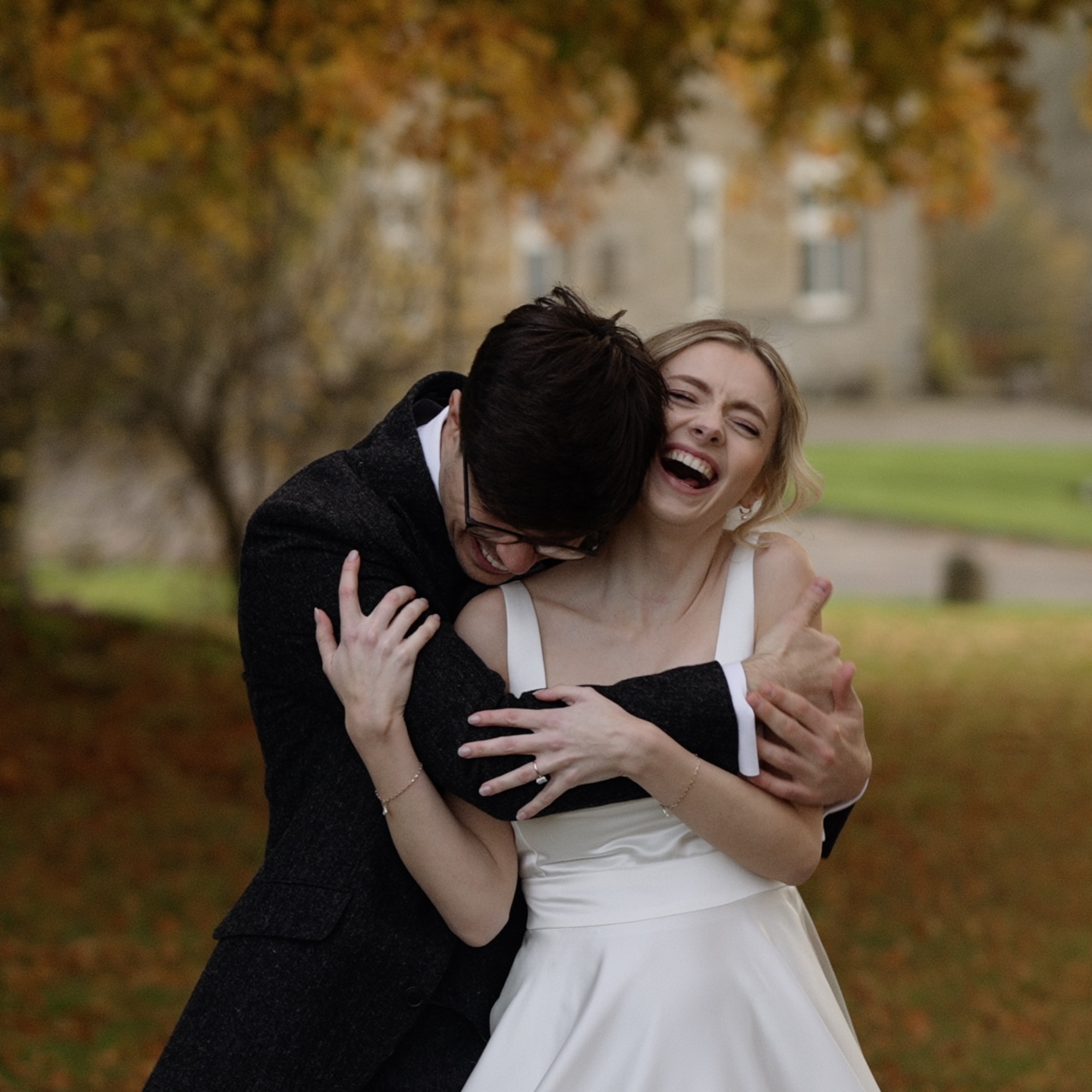 Bride and groom cuddling at Oxford wedding