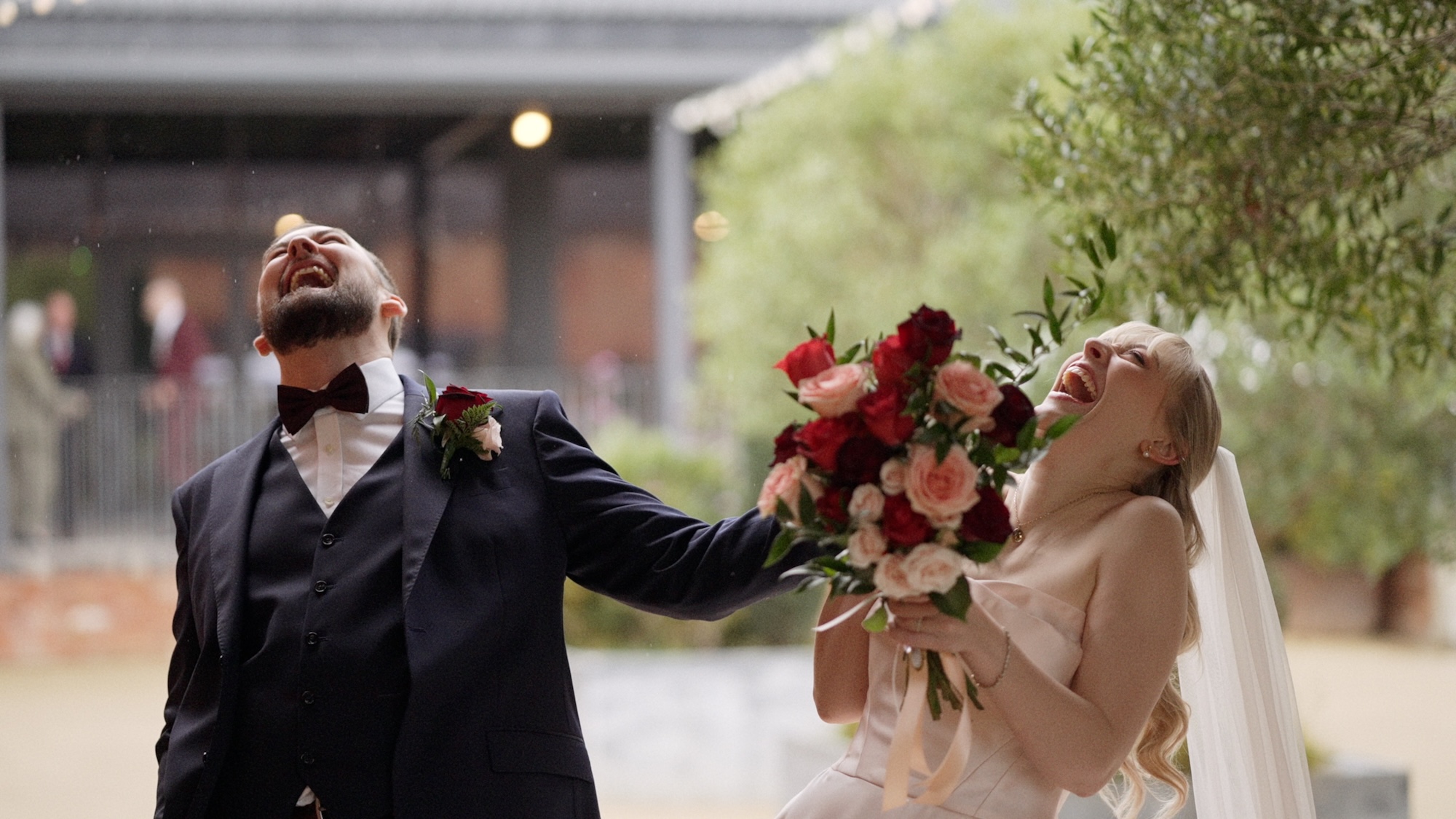 Bride & groom laughing at Grangefields courtyard