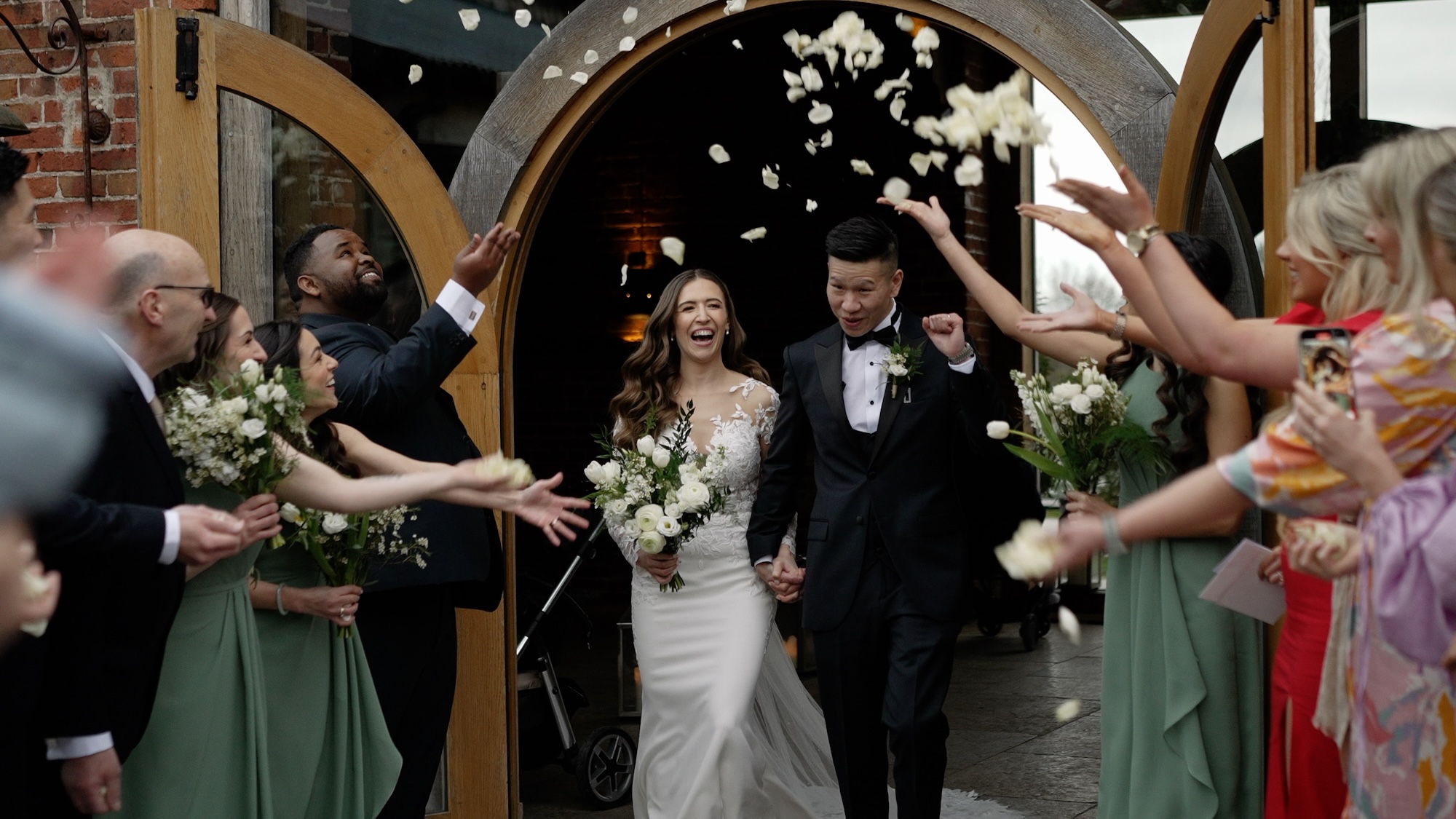 Bride and groom during confetti at Hazel Gap Barn