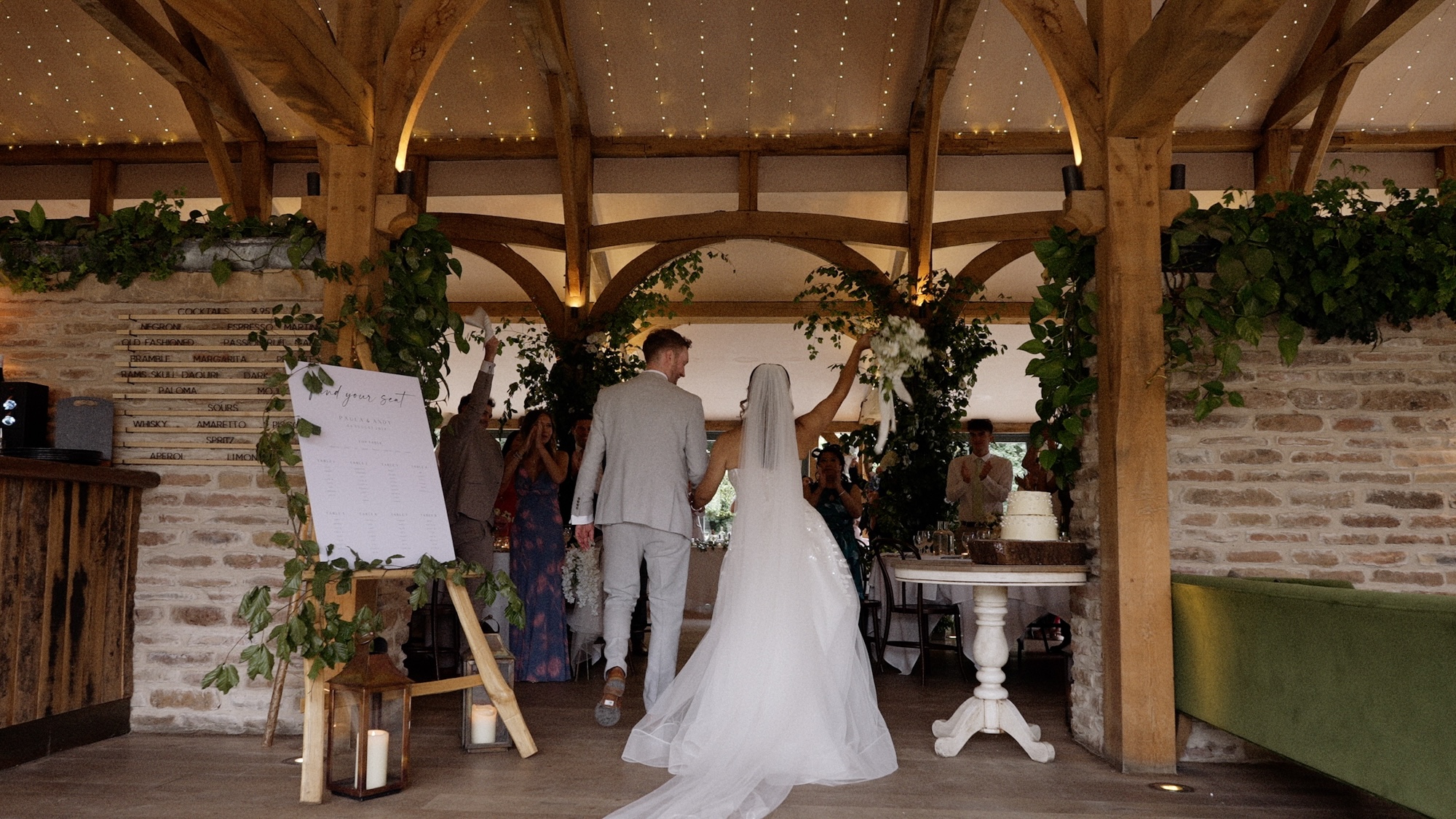Bride and groom entering the dinning hall at Hazel gap Barn