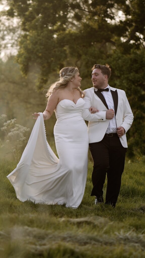 Bride & Groom walking at Norwood Park in Nottingham wedding